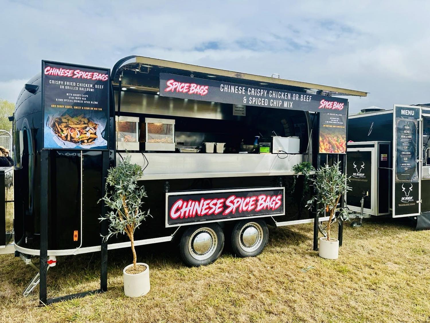 The Airstream kitchen trading at a festival with bespoke branding fitted for the event.