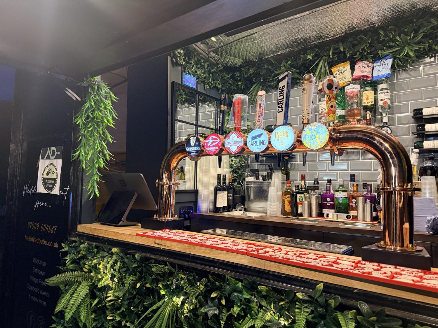 The copper T-bar font pouring Guinness, Cruzcampo, Carling, Inch's and Neck Oil.